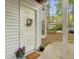 Charming entrance featuring a decorated front door, potted plants, and cozy welcome mat at 6820 Glenridge Dr # C, Sandy Springs, GA 30328