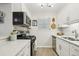 Efficient kitchen featuring stainless steel appliances, white cabinetry, and stylish backsplash at 6820 Glenridge Dr # C, Sandy Springs, GA 30328