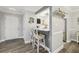 Eat-in bar view to the kitchen with white cabinets, and stainless steel appliances at 6820 Glenridge Dr # C, Sandy Springs, GA 30328