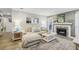 Bright living room with a large couch, white fireplace, and light grey walls at 6820 Glenridge Dr # C, Sandy Springs, GA 30328