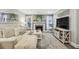 Open living space with a decorative fireplace, modern TV, and comfortable seating area at 6820 Glenridge Dr # C, Sandy Springs, GA 30328
