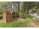 Elegant community sign with brick accents and mature landscaping, welcoming residents and guests to Glenridge Park at 6820 Glenridge Dr # C, Sandy Springs, GA 30328