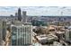 Sprawling aerial shot capturing downtown cityscape with modern high-rise buildings and a serene rooftop pool at 860 Peachtree Ne St # 2716, Atlanta, GA 30308