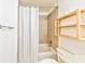 Clean bathroom featuring a shower-tub combo, modern fixtures, and a stylish shower curtain at 860 Peachtree Ne St # 2716, Atlanta, GA 30308