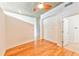 Minimalist bedroom features hardwood floors, clean white walls and bright natural light at 860 Peachtree Ne St # 2716, Atlanta, GA 30308