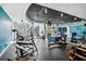 Modern gym equipped with cardio machines, weights, and floor-to-ceiling windows overlooking the city at 860 Peachtree Ne St # 2716, Atlanta, GA 30308