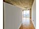 Hallway with hardwood floors, a view of the city, and access to the room at 860 Peachtree Ne St # 2716, Atlanta, GA 30308