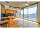 Modern kitchen featuring stainless steel appliances, wood cabinets, and an adjacent outdoor view at 860 Peachtree Ne St # 2716, Atlanta, GA 30308