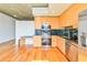 Well-equipped kitchen boasting stainless steel appliances, sleek black countertops, and ample cabinet space at 860 Peachtree Ne St # 2716, Atlanta, GA 30308