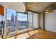 Modern living room featuring floor-to-ceiling windows, hardwood floors, and stunning city views at 860 Peachtree Ne St # 2716, Atlanta, GA 30308