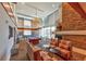 Two-story lounge area with pool table, fireplace, and modern furniture at 860 Peachtree Ne St # 2716, Atlanta, GA 30308
