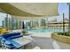 Rooftop pool area with city views, lounge seating, and shade canopies creates an inviting atmosphere at 860 Peachtree Ne St # 2716, Atlanta, GA 30308