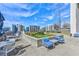 Large landscaped roof deck with outdoor seating areas offers relaxing city views at 860 Peachtree Ne St # 2716, Atlanta, GA 30308