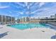 Rooftop pool surrounded by lounge chairs and city views at 860 Peachtree Ne St # 2716, Atlanta, GA 30308