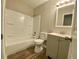 This bathroom features updated fixtures, tub and vanity at 927 Pine Oak Trl, Austell, GA 30168