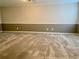Spacious bedroom featuring two-toned walls and neutral carpeting at 927 Pine Oak Trl, Austell, GA 30168