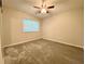 This bedroom features neutral paint, updated carpet and a ceiling fan at 927 Pine Oak Trl, Austell, GA 30168
