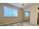 Bedroom featuring a mirrored closet, ceiling fan, and a window at 927 Pine Oak Trl, Austell, GA 30168