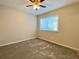 Bedroom features neutral walls, carpet, a window, and ceiling fan at 927 Pine Oak Trl, Austell, GA 30168