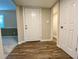 The foyer has laminate floors and is open to the rest of the house at 927 Pine Oak Trl, Austell, GA 30168