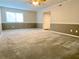 Spacious living room with neutral carpet, two-tone paint, ceiling fan, and open floor plan at 927 Pine Oak Trl, Austell, GA 30168