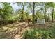 Spacious backyard with mature trees and two storage sheds, providing ample outdoor space at 1700 John Calvin Ave, Atlanta, GA 30337