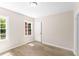 Bright bedroom with hardwood floors, neutral walls, and natural light from two windows at 1700 John Calvin Ave, Atlanta, GA 30337