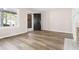 Spacious living room featuring wood floors, neutral paint, and natural lighting at 1700 John Calvin Ave, Atlanta, GA 30337