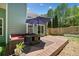Backyard featuring an outdoor seating area, a wooden deck, privacy fence, and green landscaping at 210 Cole Ct, Canton, GA 30114
