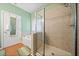 Bathroom with a combination shower and tub, shower with glass door, and hardwood floors at 210 Cole Ct, Canton, GA 30114
