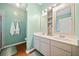 Bathroom with double vanity, walk-in shower, and hardwood floors at 210 Cole Ct, Canton, GA 30114