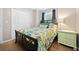 This is a bedroom with a decorated queen bed, a window with blue curtains, and a nightstand at 210 Cole Ct, Canton, GA 30114