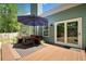 Deck featuring outdoor seating with a sun umbrella, overlooking the backyard at 210 Cole Ct, Canton, GA 30114