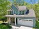 Charming two-story home with a covered porch and a two-car garage at 210 Cole Ct, Canton, GA 30114