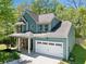 Charming two-story home with a covered porch and a two-car garage at 210 Cole Ct, Canton, GA 30114