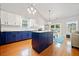 Modern kitchen with stainless steel appliances, a large island, and hardwood floors at 210 Cole Ct, Canton, GA 30114