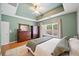 Large main bedroom with a window, tray ceiling, neutral walls, and beautiful hardwood floors at 210 Cole Ct, Canton, GA 30114