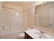A bathroom features a shower and tub combo with a shower curtain and a single sink vanity at 4354 Favored Way, Union City, GA 30291