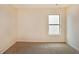 A carpeted bedroom has neutral walls and a window with privacy blinds at 4354 Favored Way, Union City, GA 30291