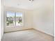 A bedroom features a large window with views of neighborhood properties at 4354 Favored Way, Union City, GA 30291