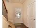 Inviting entryway featuring stairs, tile floor and a door with decorative glass at 4354 Favored Way, Union City, GA 30291
