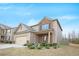 Two-story home with beige siding and a brick front, set against a blue sky at 4354 Favored Way, Union City, GA 30291