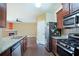 Modern kitchen with stainless steel appliances, granite countertops and hardwood floors at 4354 Favored Way, Union City, GA 30291