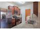 Modern kitchen with stainless steel appliances and granite countertops overlooking the laundry room at 4354 Favored Way, Union City, GA 30291