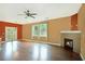 Spacious living room with hardwood floors, fireplace, neutral walls and lots of natural light at 4354 Favored Way, Union City, GA 30291