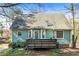 Backyard view featuring a wooden deck and lush greenery at 495 Stratford Dr, Douglasville, GA 30134