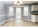 Bright dining area with a bay window and door to backyard at 495 Stratford Dr, Douglasville, GA 30134