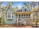 Charming cottage-style home with inviting front porch and landscaped yard at 495 Stratford Dr, Douglasville, GA 30134