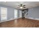 Spacious living room with hardwood floors, ceiling fan and natural light at 495 Stratford Dr, Douglasville, GA 30134