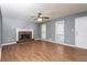 Inviting living room featuring a brick fireplace and hardwood floors at 495 Stratford Dr, Douglasville, GA 30134